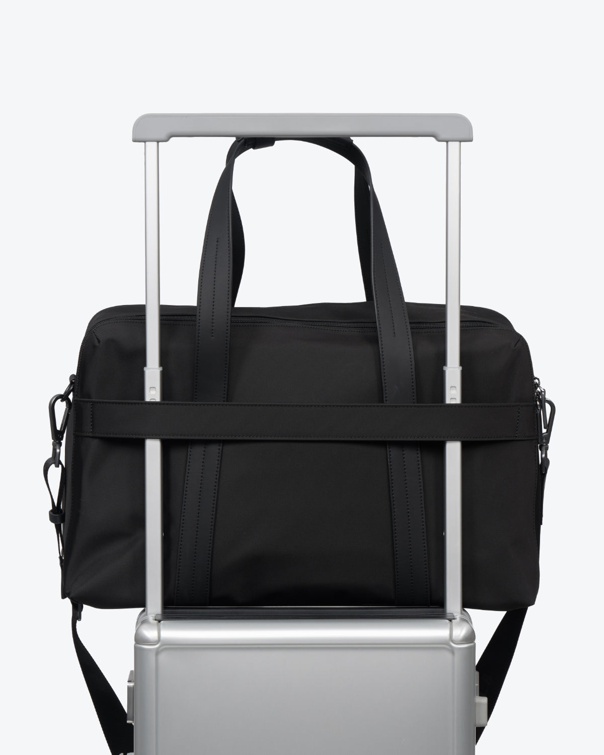 LEVEL8 CITYGO Weekender Bag secured on suitcase handle with trolley sleeve